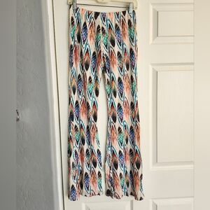 White flared pants with colorful feather print
